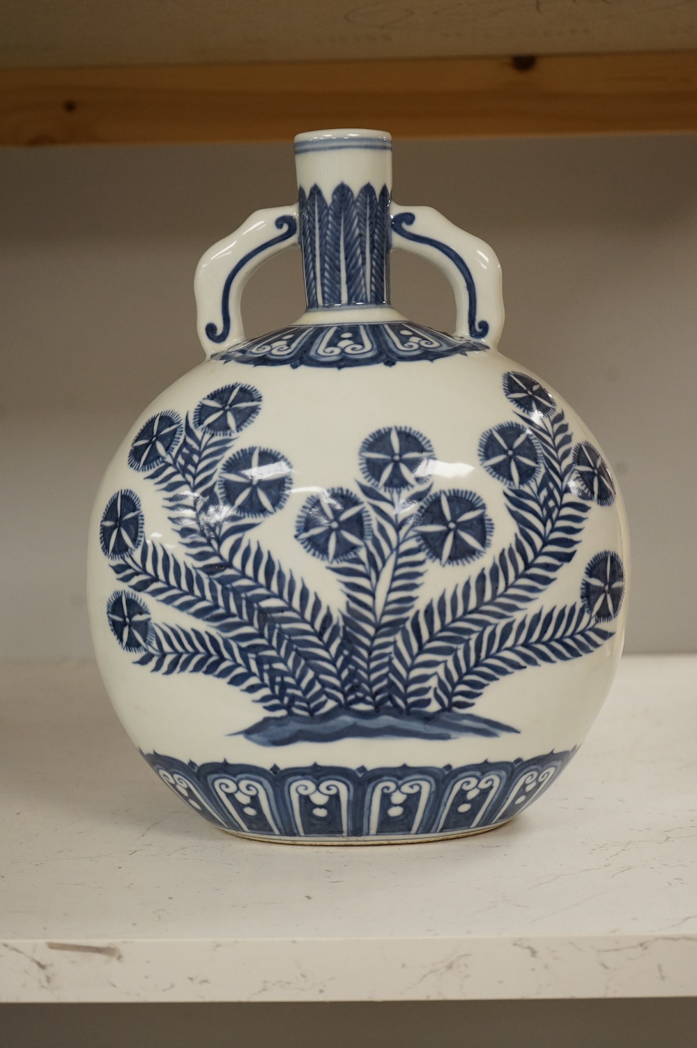 A Chinese blue and white moonflask, Yongzheng mark but later, 27cm. Condition - good